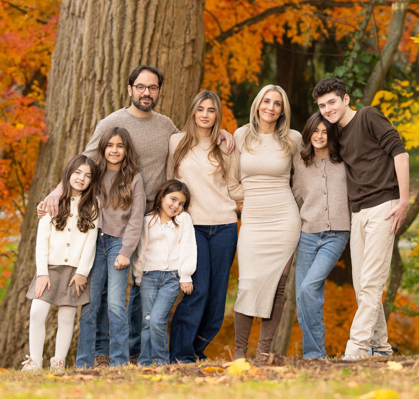Family portrait under an autumn tree